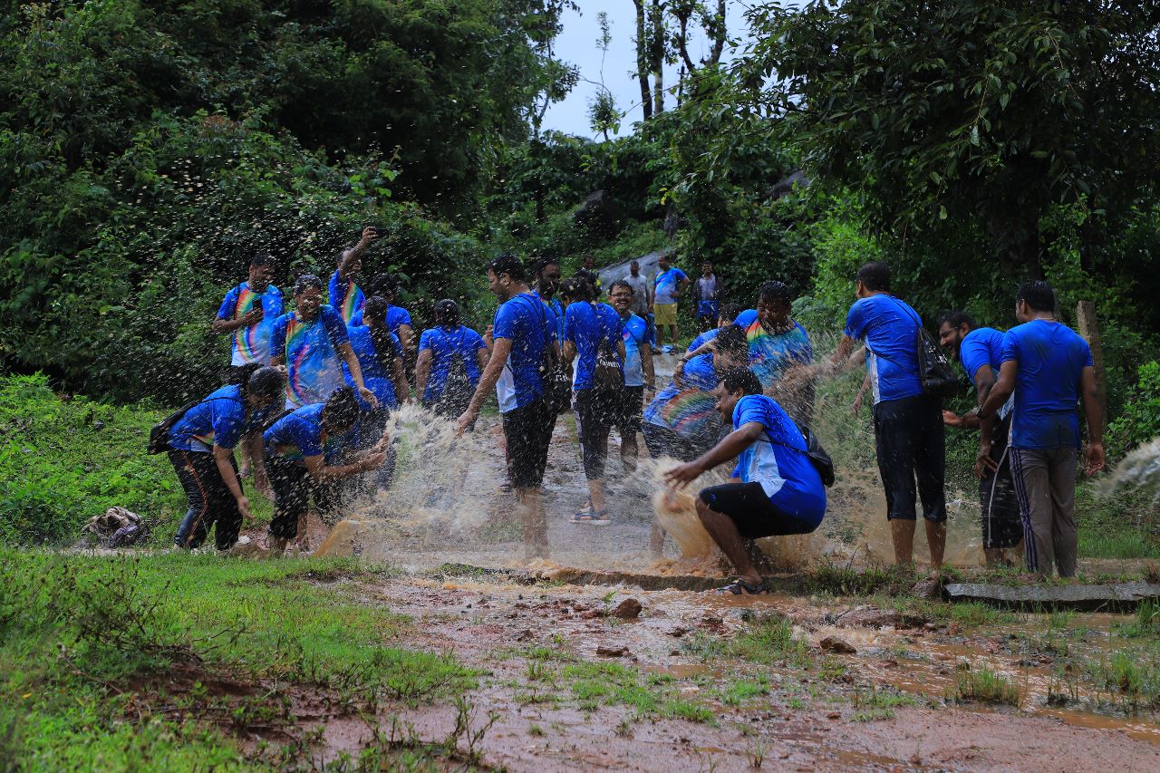 Rainathon participants walking through lush rainy forest trails